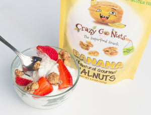 A bag of coated banana walnut snacks used as a topping on yogurt with strawberries