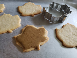 Maple leaf-shaped cookies iced with maple walnut butter instead of icing