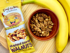 Banana coated walnut snacks in a dish with a banana
